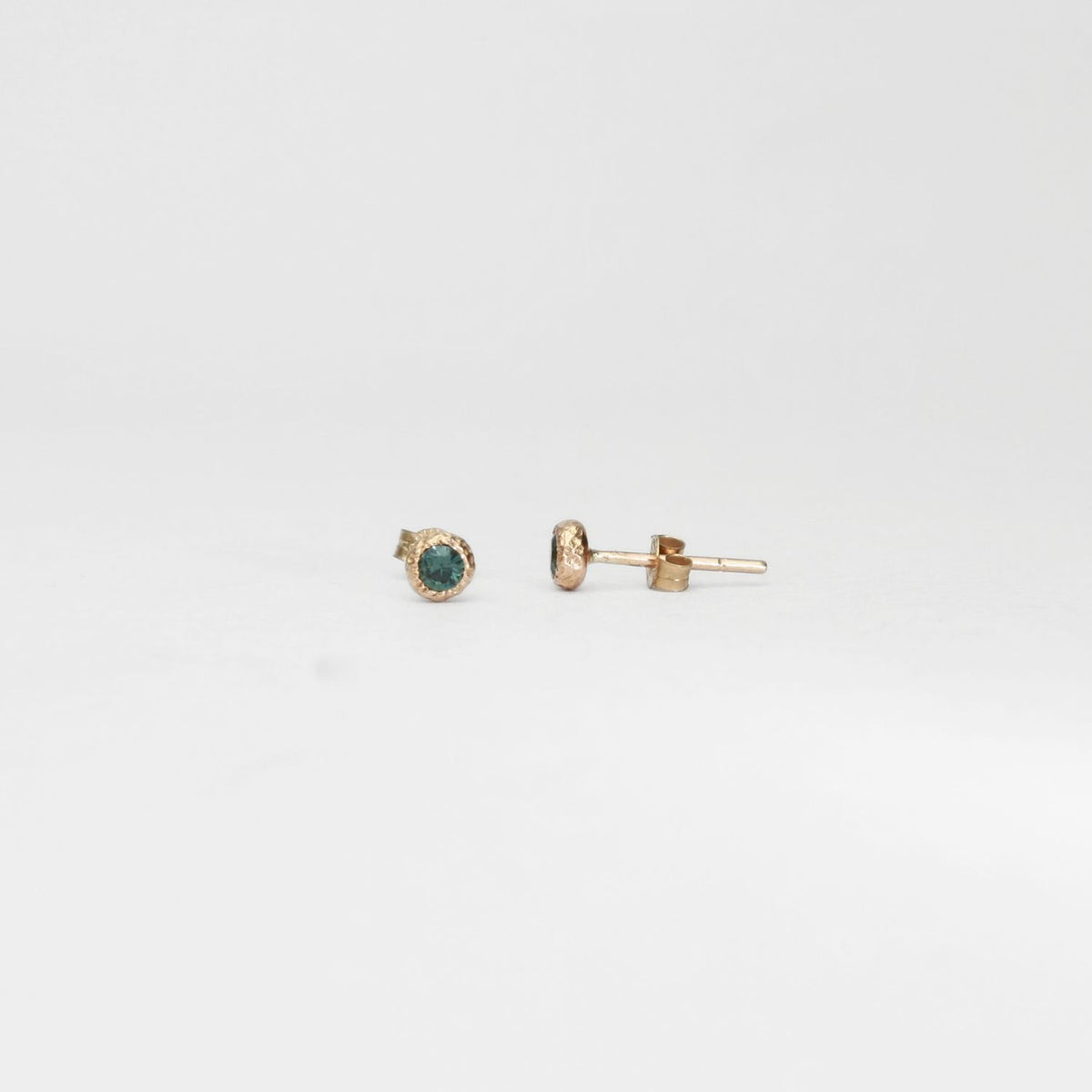 9ct gold textured pebble studs with Australian parti sapphires by Blae Maddrell