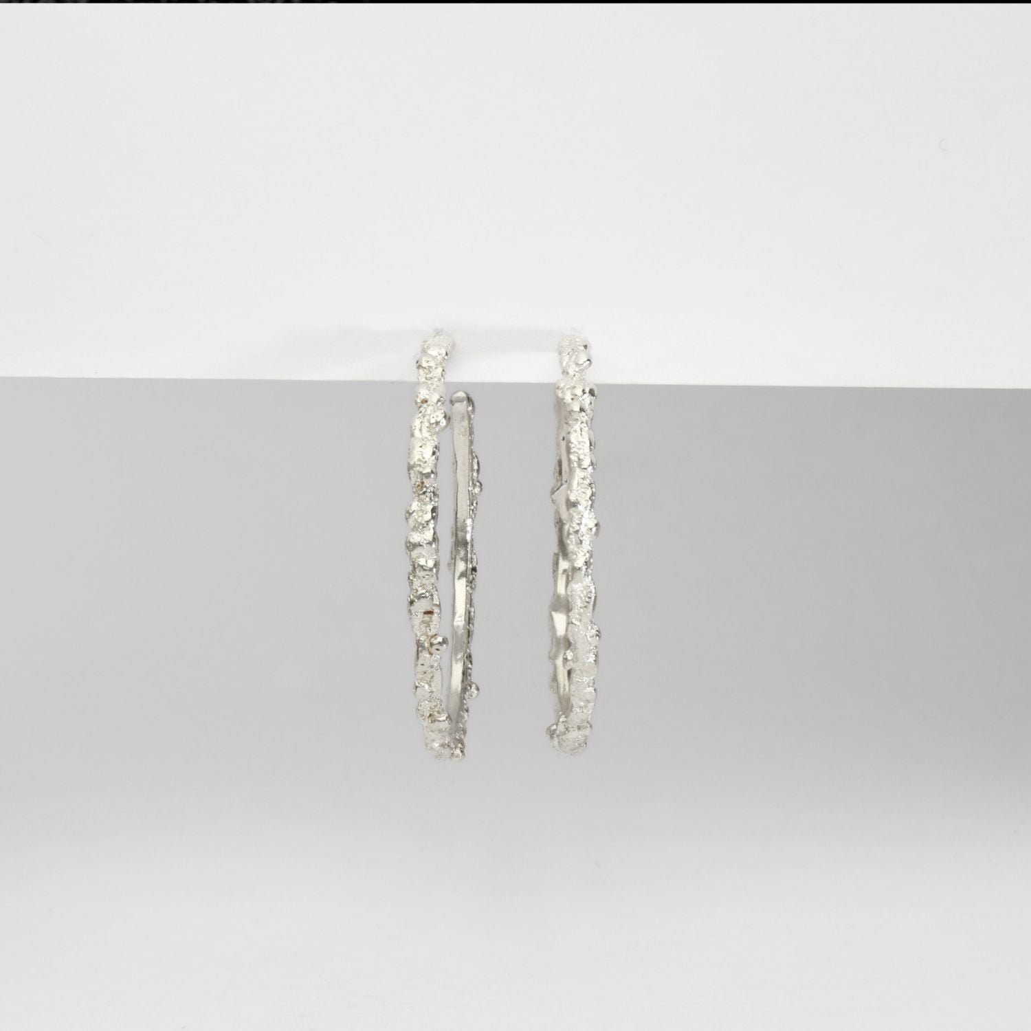 Large silver coral hoops by Blae Maddrell