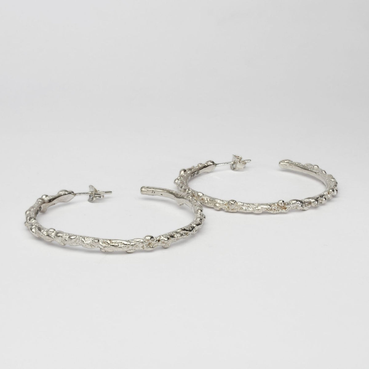 Large silver coral hoops by Blae Maddrell