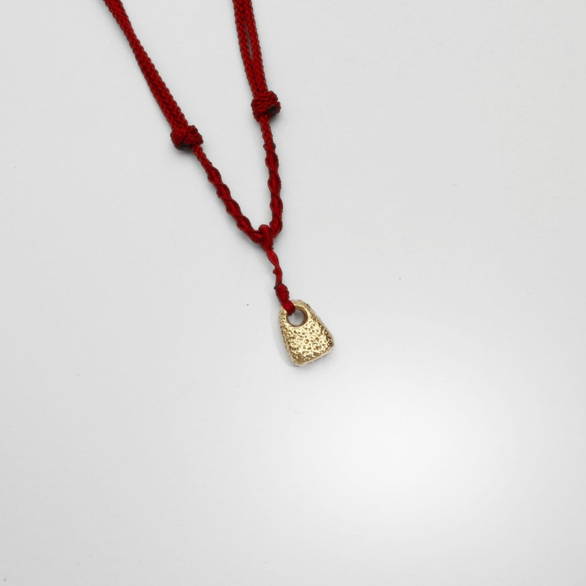 9ct gold hag stone pendant on Japanese hand braided silk cord by Blae Maddrell