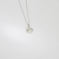 Silver mini cockle shell pendant by Blae Maddrell