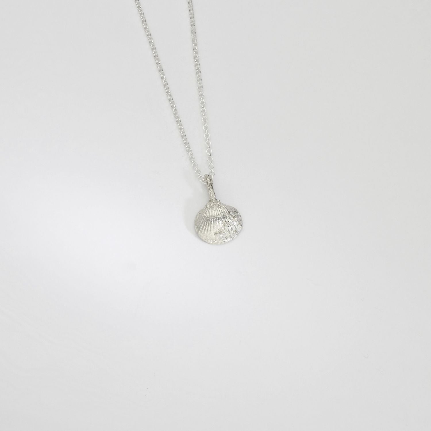 Silver mini cockle shell pendant by Blae Maddrell