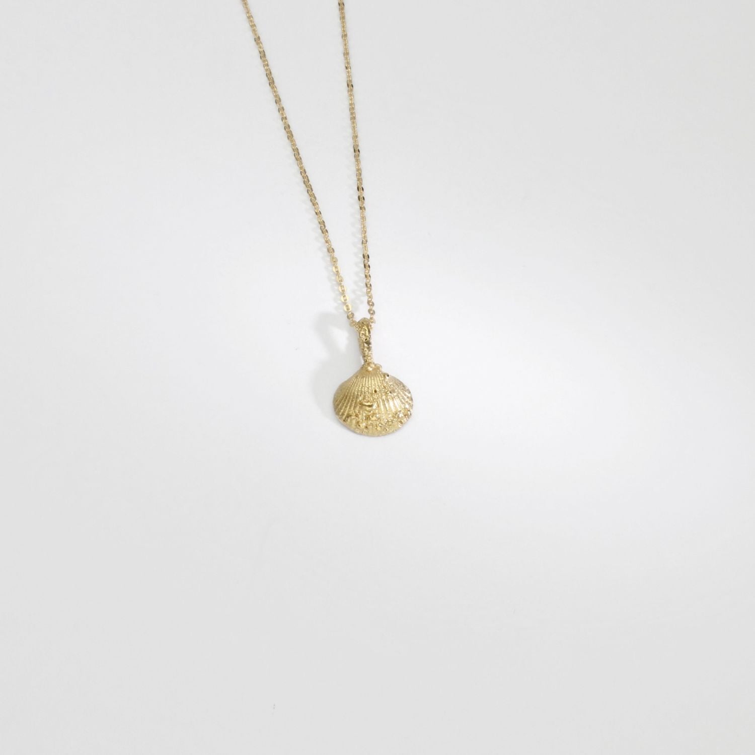 9ct gold mini cockle shell pendant by Blae Maddrell