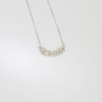 Silver selkie necklace with pink sapphire & moissanite by Blae Maddrell