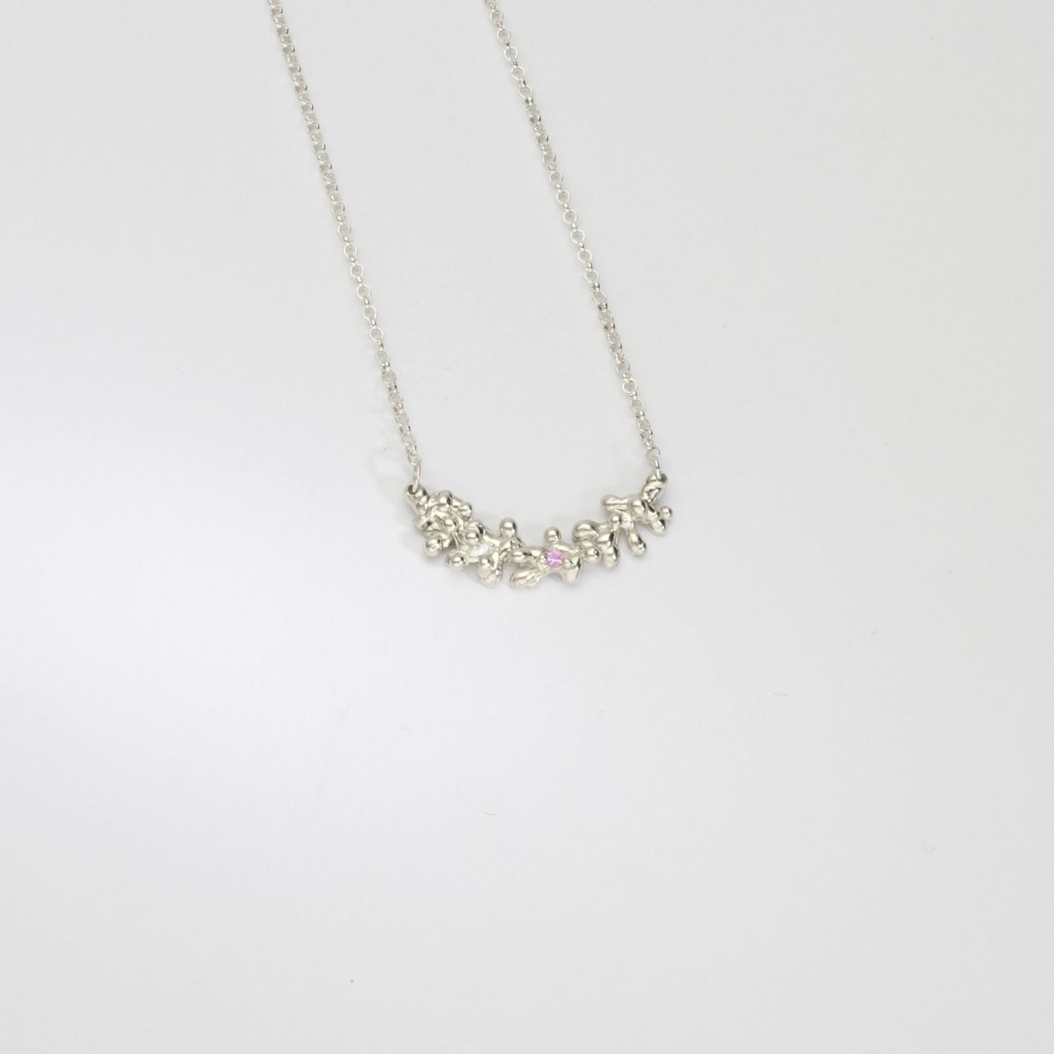 Silver selkie necklace with pink sapphire & moissanite by Blae Maddrell