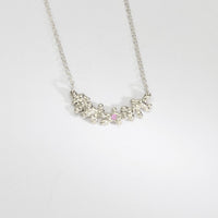 Silver selkie necklace with pink sapphire & moissanite by Blae Maddrell
