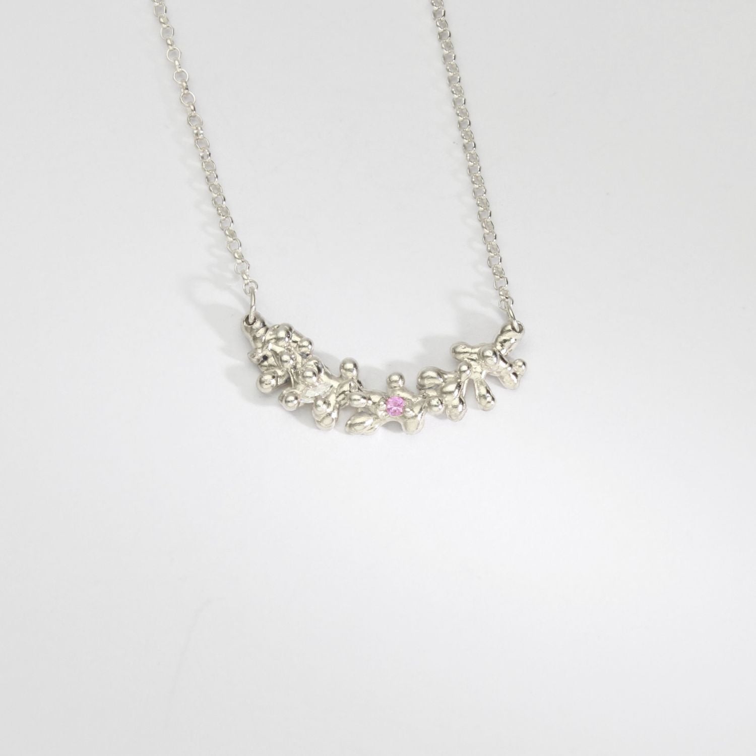 Silver selkie necklace with pink sapphire & moissanite by Blae Maddrell