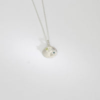 Silver shell necklace with peridot, moissanite and swiss blue topaz by Blae Maddrell