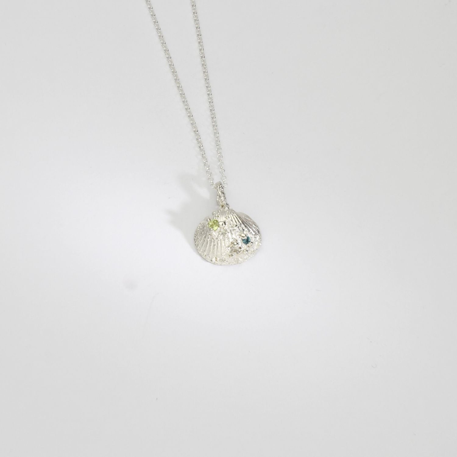 Silver shell necklace with peridot, moissanite and swiss blue topaz by Blae Maddrell