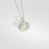 Silver shell necklace with peridot, moissanite and swiss blue topaz by Blae Maddrell