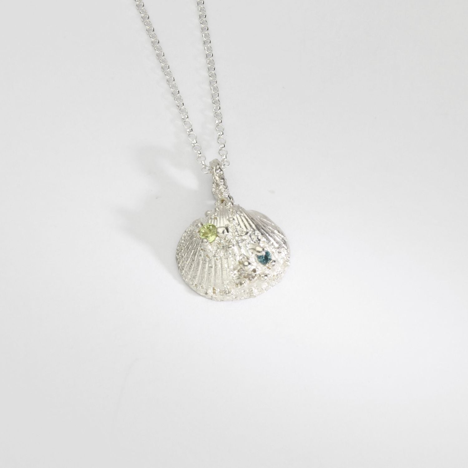 Silver shell necklace with peridot, moissanite and swiss blue topaz by Blae Maddrell