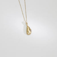 9ct gold muscle shell necklace with salt & pepper diamond & tanzanite by Blae Maddrell