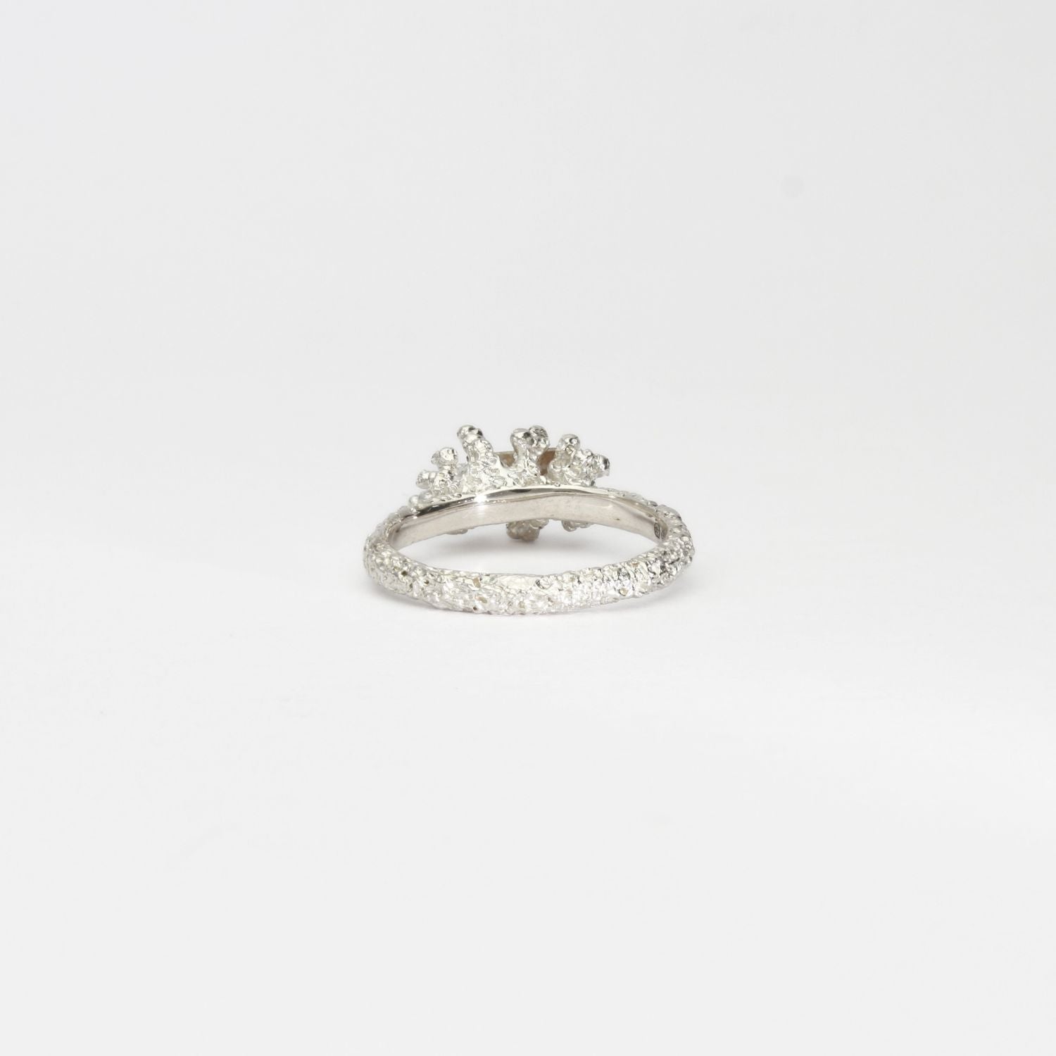 Coral cluster silver ring with pale pink zircon by Blae Maddrell