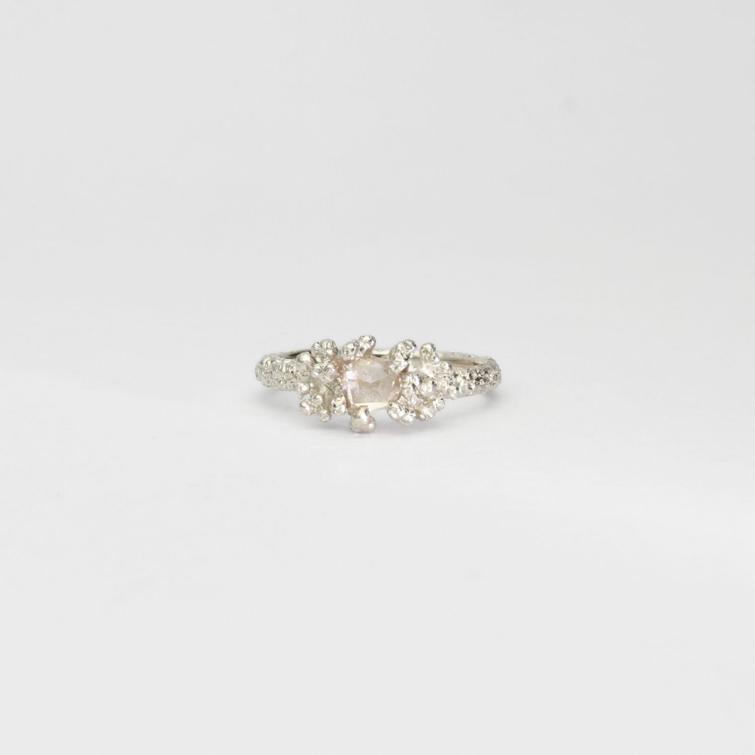 Coral cluster silver ring with pale pink zircon by Blae Maddrell