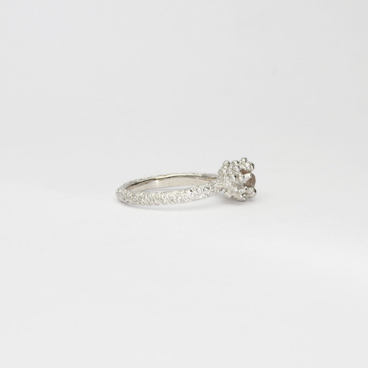 Coral cluster silver ring with pale pink zircon by Blae Maddrell