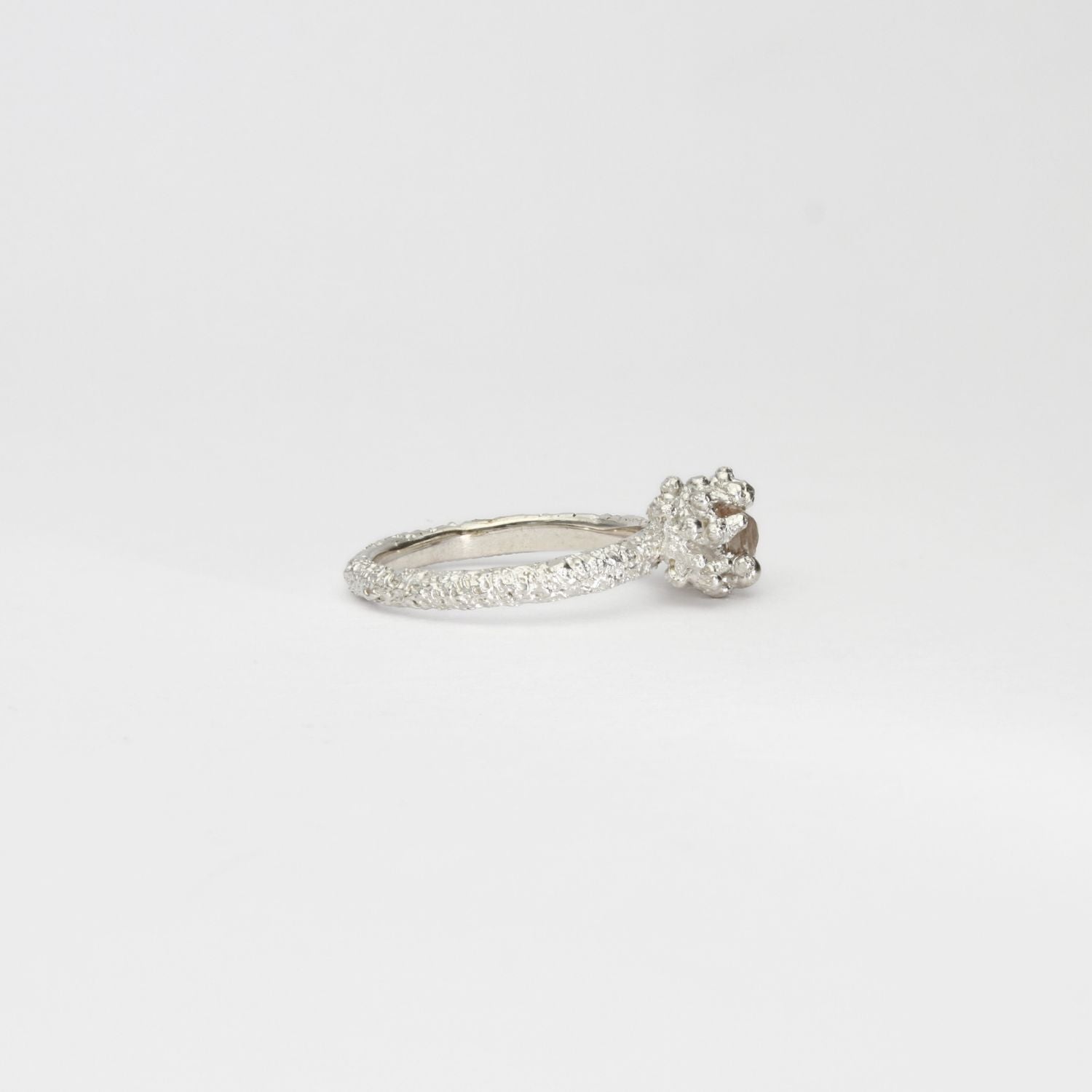 Coral cluster silver ring with pale pink zircon by Blae Maddrell