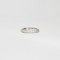 Silver eternity sand band with small moissanites by Blae Maddrell