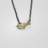 Rutile quartz & zircon black silver pendant by Chris Boland