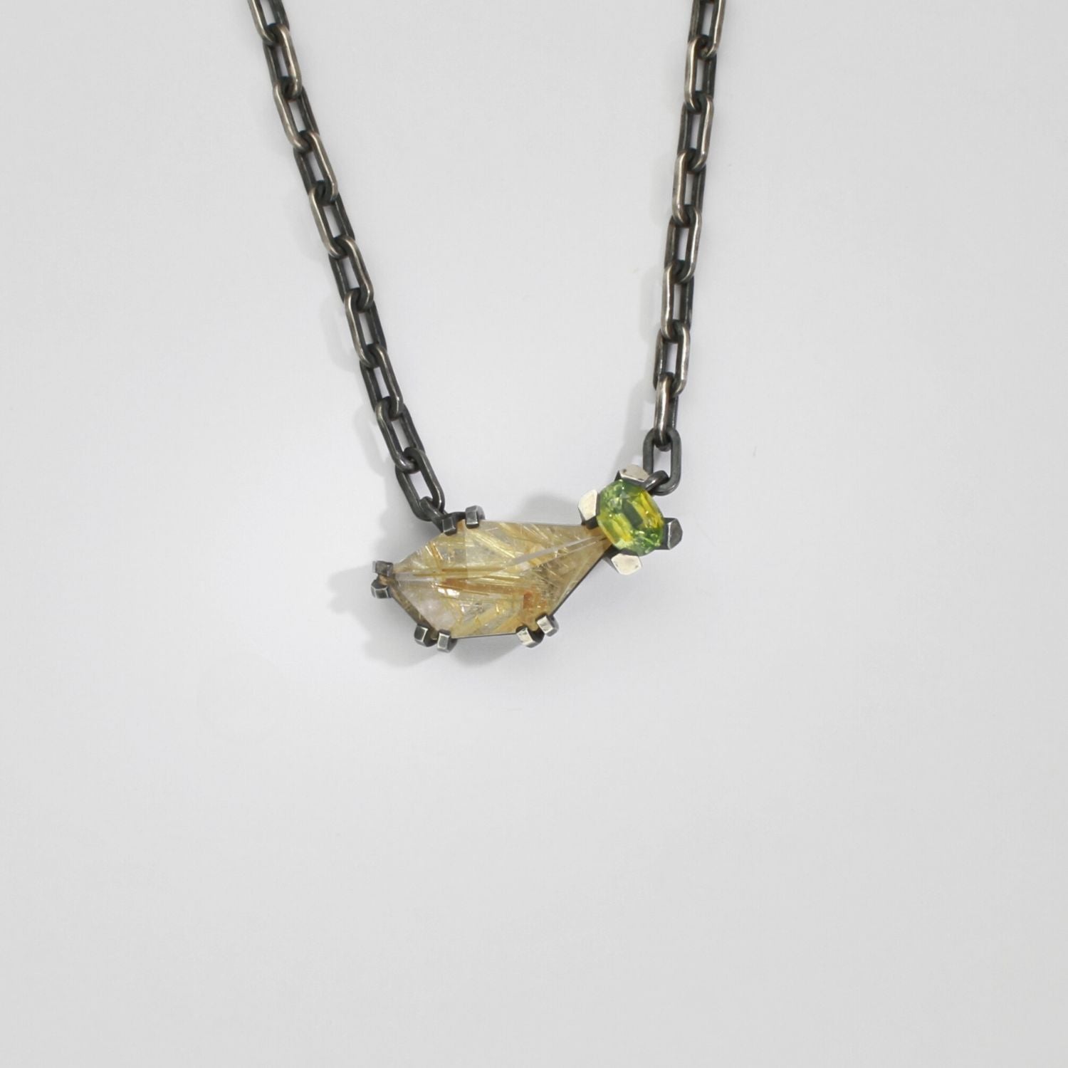 Rutile quartz & zircon black silver pendant by Chris Boland