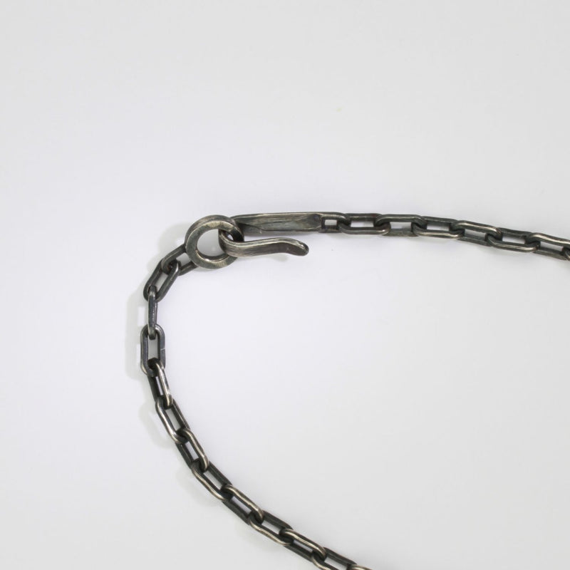 Rutile quartz & zircon black silver pendant by Chris Boland