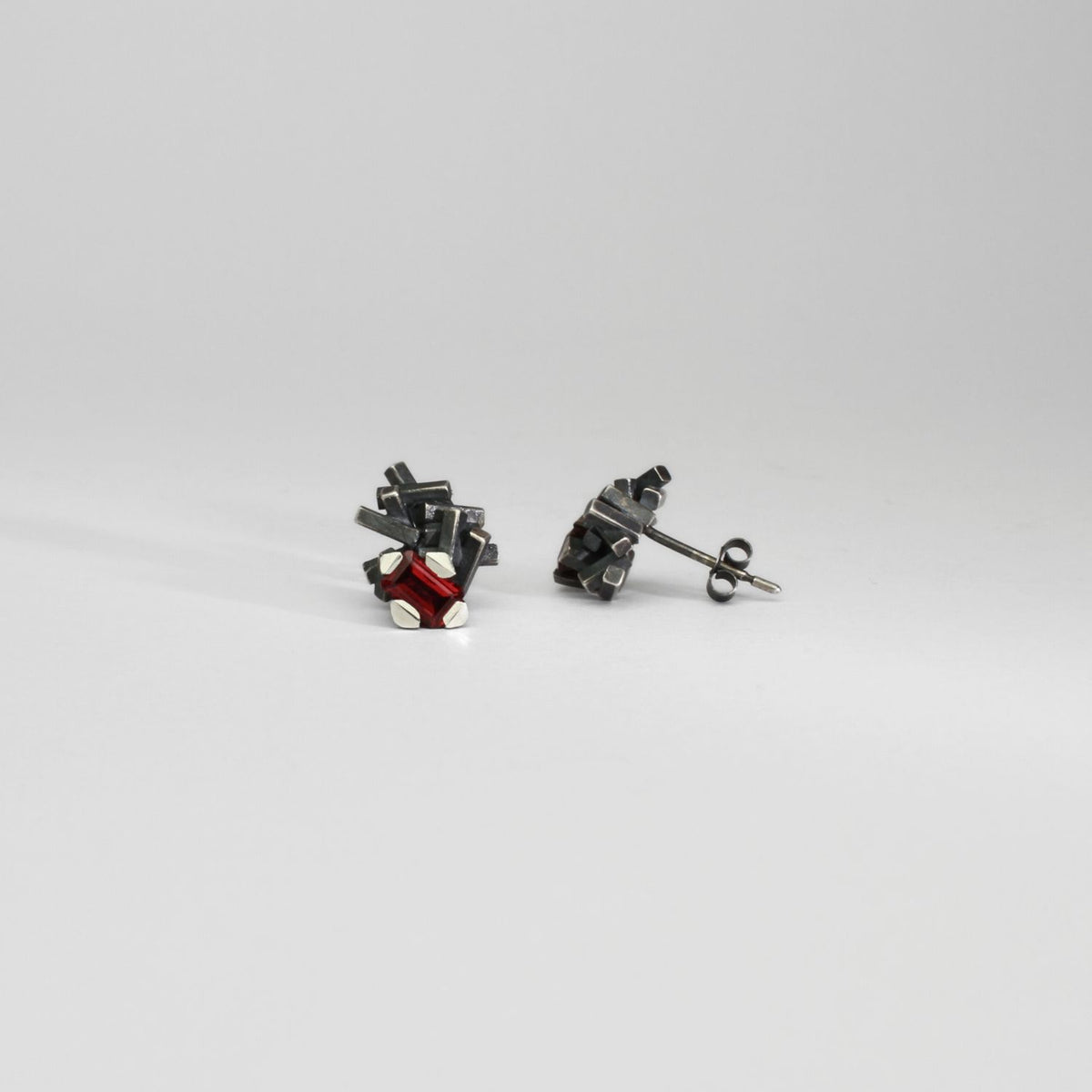 Garnet black silver studs by Chris Boland