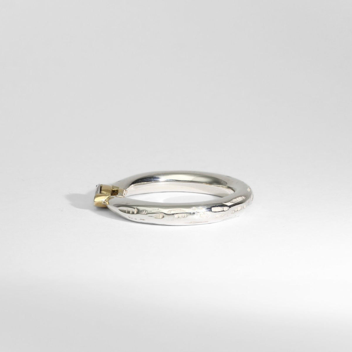 Halo silver ring with a marquise diamond in a 18ct setting by Charmian Ottaway