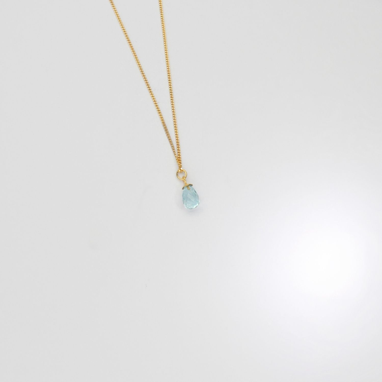 Small sky blue topaz drop pendant silver with 22ct gold plating by Charlotte Reid