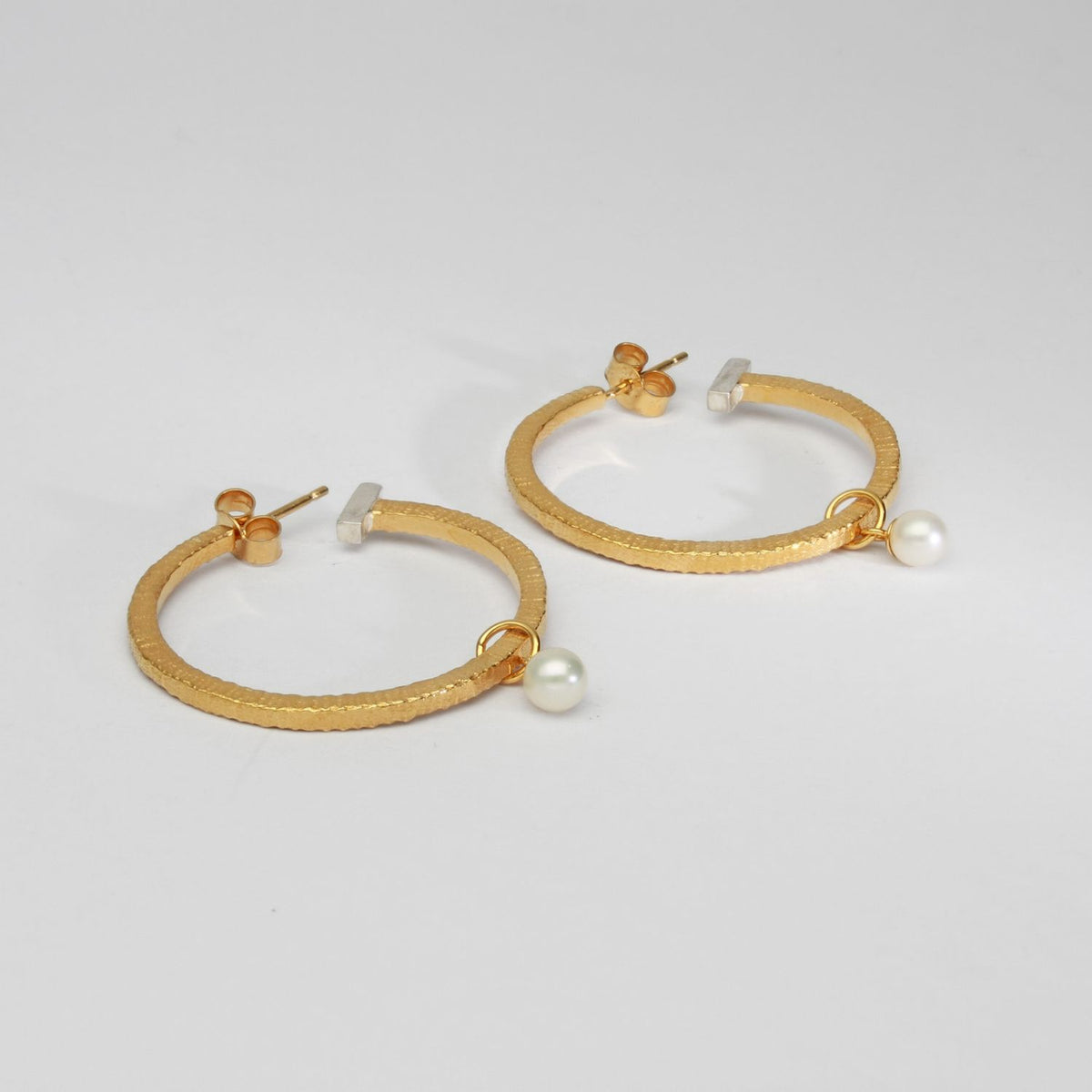 Textured hoops with pearls silver with 22ct gold plating by Charlotte Reid