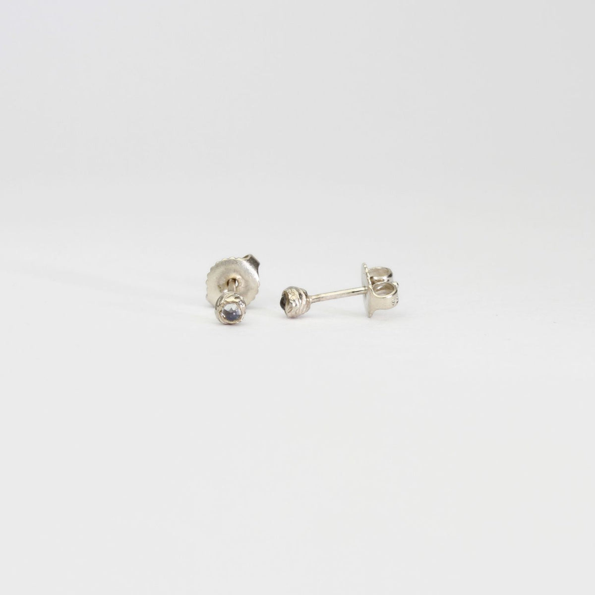 Seed studs in silver with moonstones by Charlotte Rowenna