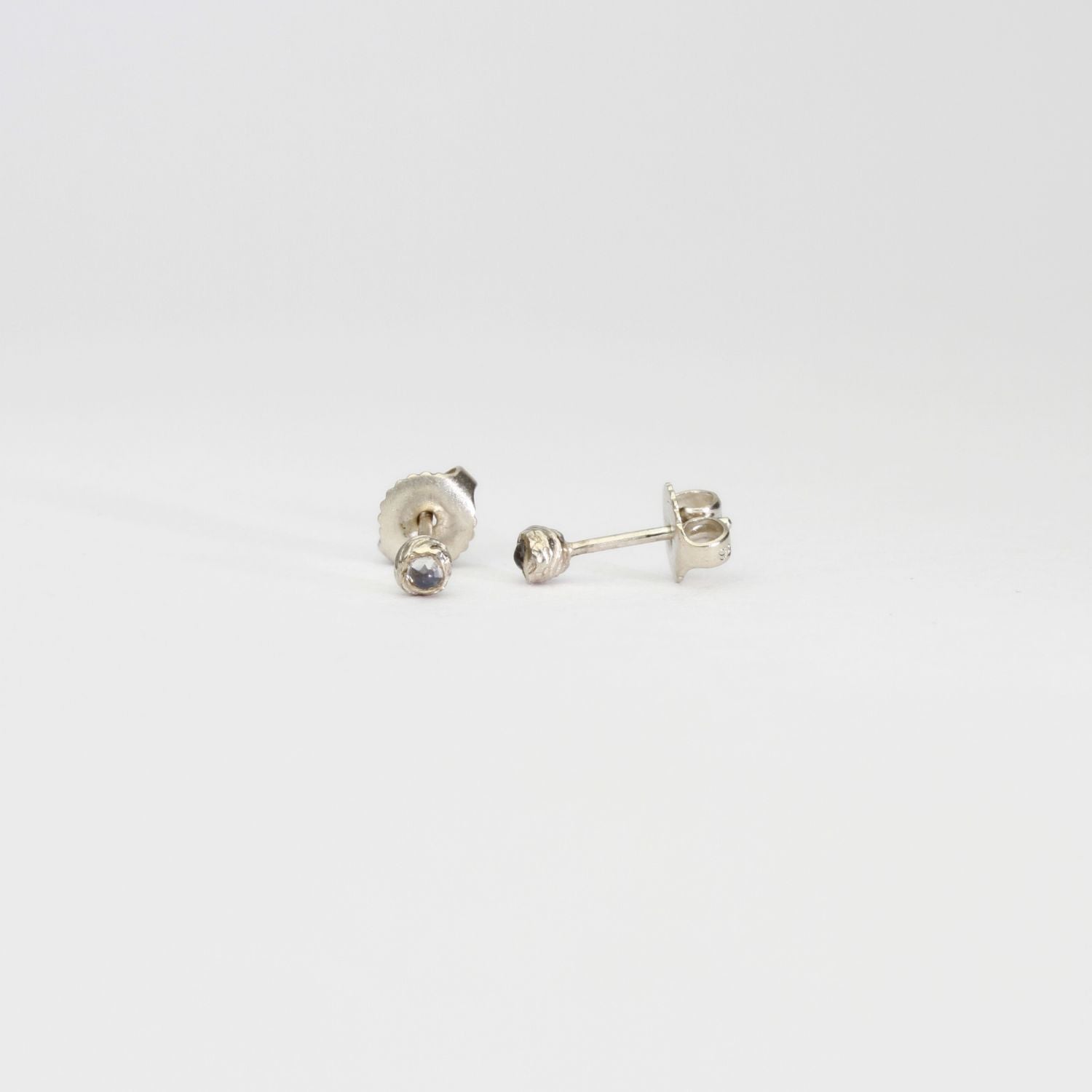 Seed studs in silver with moonstones by Charlotte Rowenna