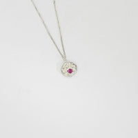 Twisted silver pendant with pink sapphire by Charlotte Reid