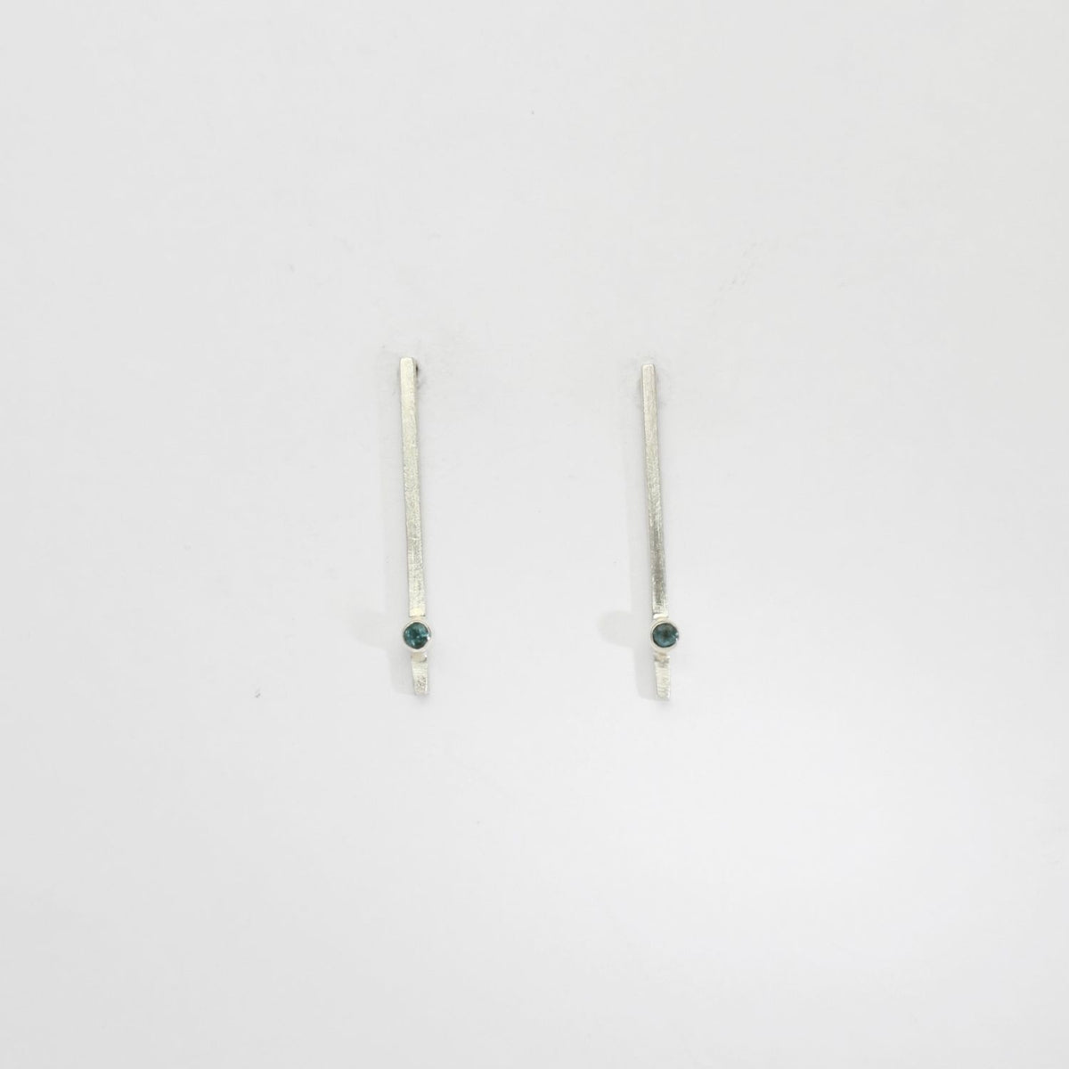 Long bar silver studs with blue topaz by Charlotte Reid
