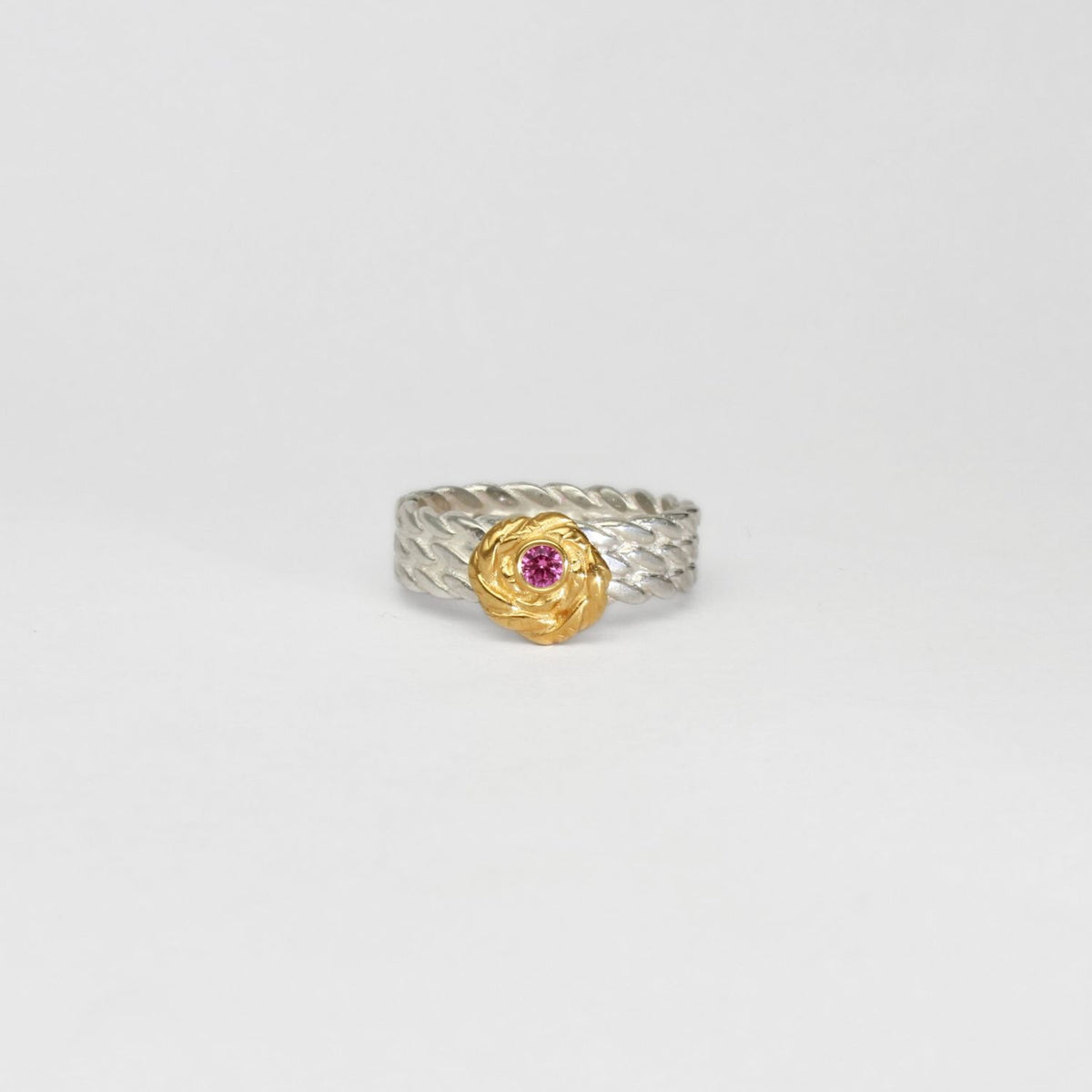 Twisted ring silver & 22ct gold plated with pink sapphire by Charlotte Reid