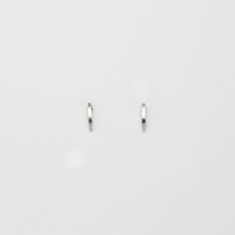 Small silver arc studs by Polished Grey