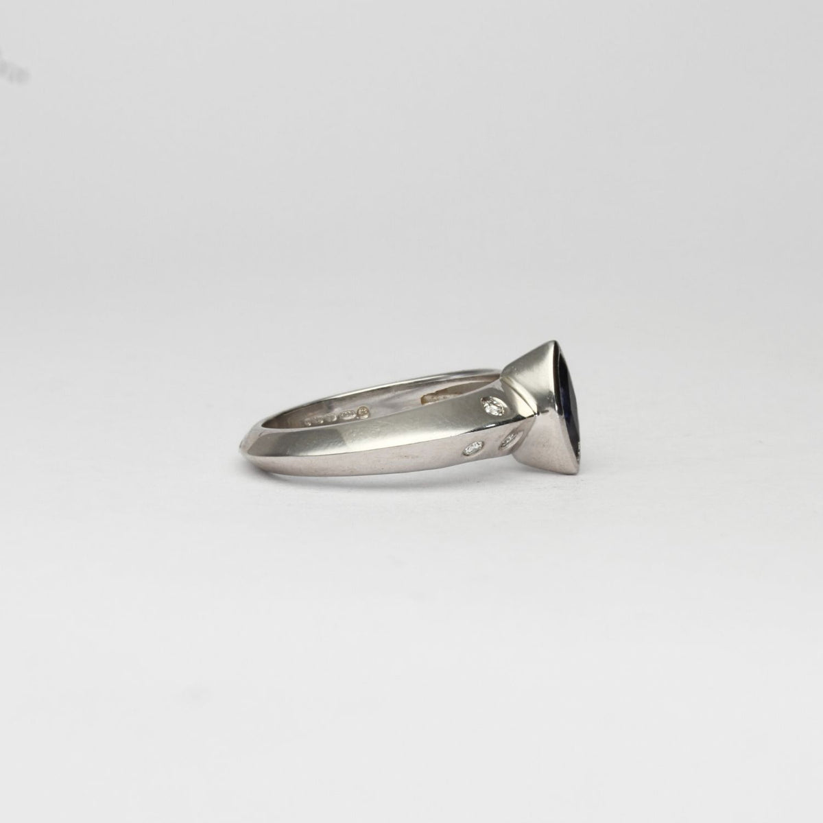 18ct white gold ring with marquise sapphire and diamonds by D E Jewellery