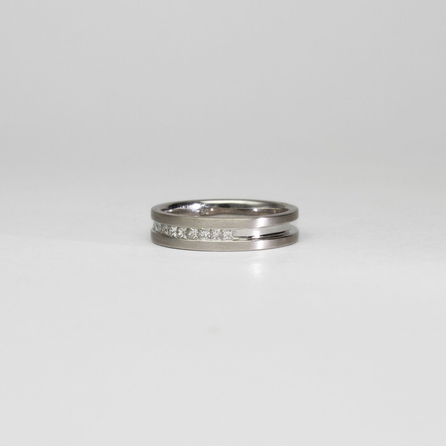 18ct white gold ring with princess cut diamonds by Duncan Eves