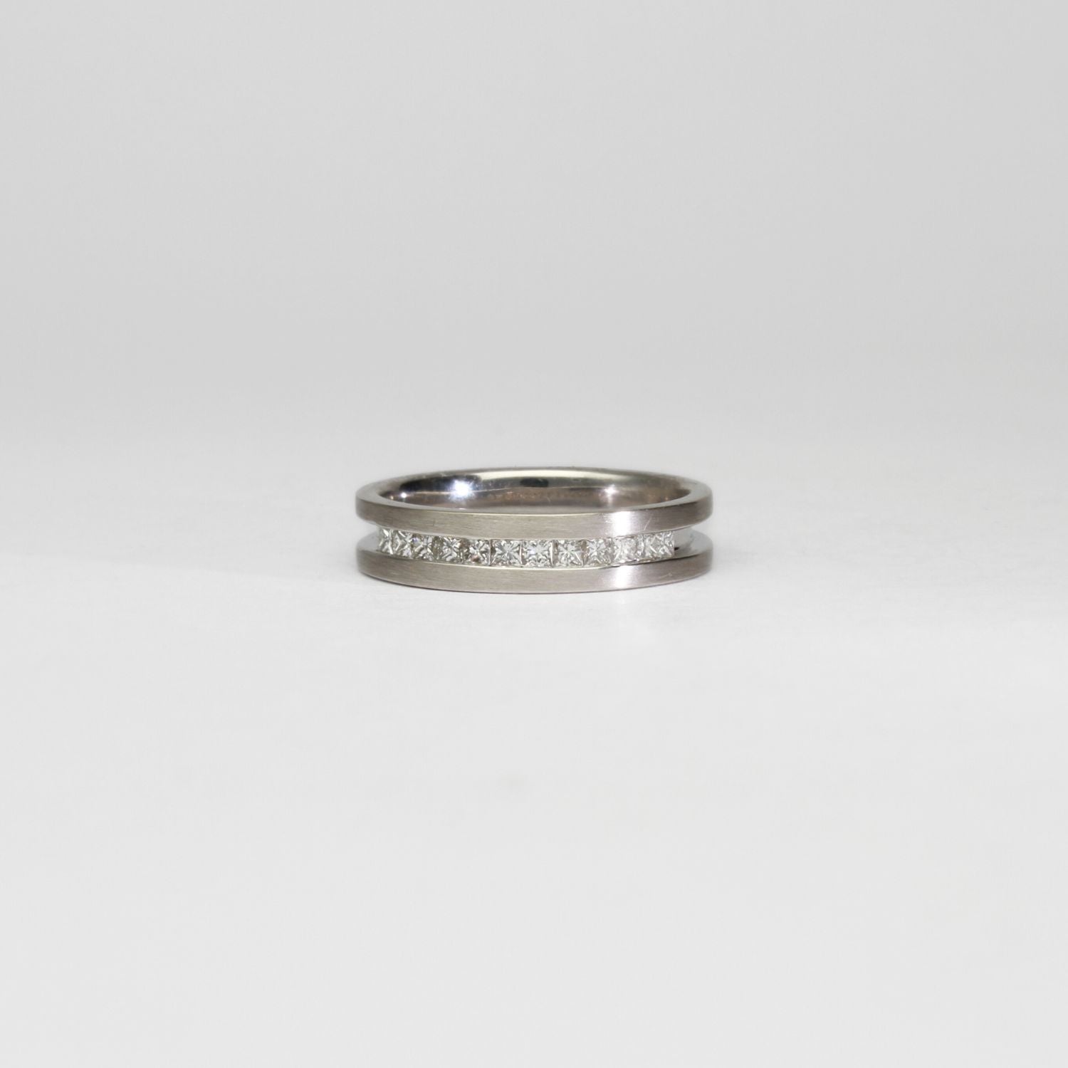 18ct white gold ring with princess cut diamonds by Duncan Eves
