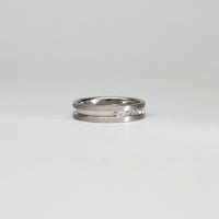 18ct white gold ring with princess cut diamonds by Duncan Eves