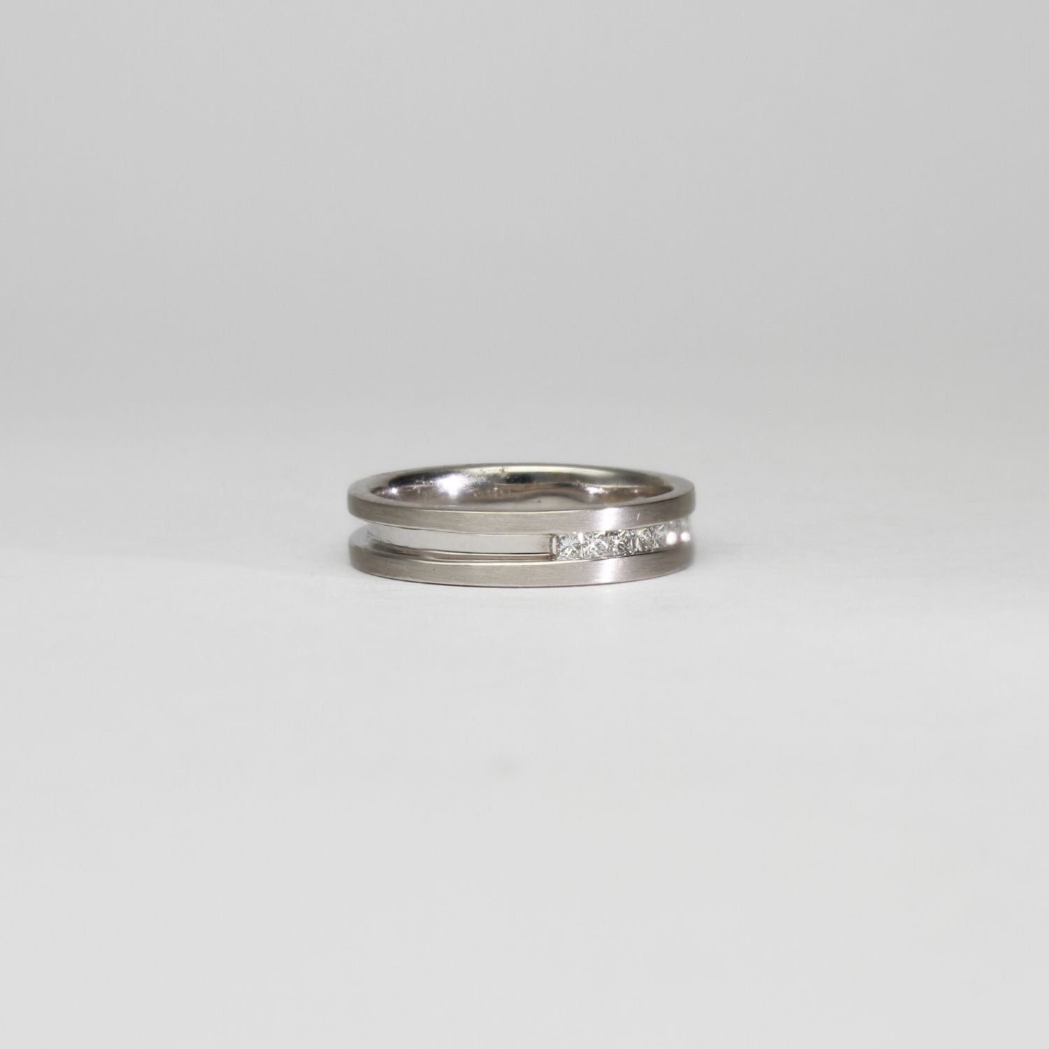 18ct white gold ring with princess cut diamonds by Duncan Eves