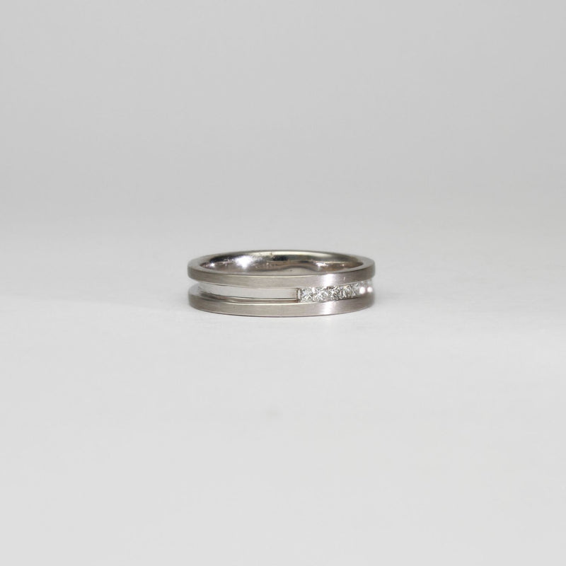 18ct white gold ring with princess cut diamonds by Duncan Eves