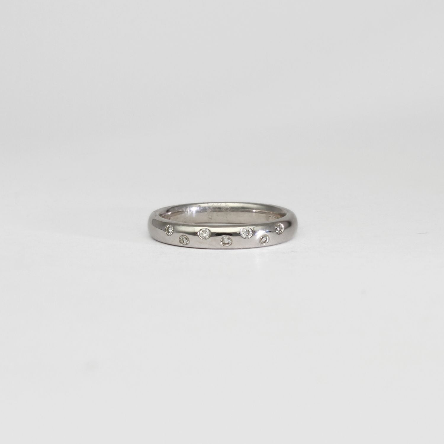 18ct white gold ring with 7 diamonds by Duncan Eves
