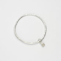 Beach hut silver charm bangle by Emily Craig