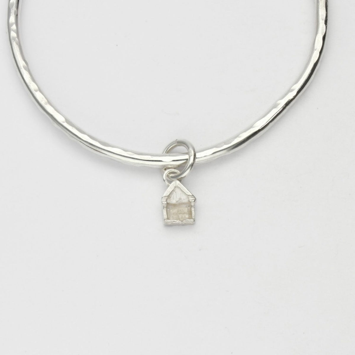 Beach hut silver charm bangle by Emily Craig