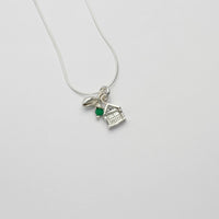 Beach hut with cowrie silver pendant with emerald bead by Emily Craig