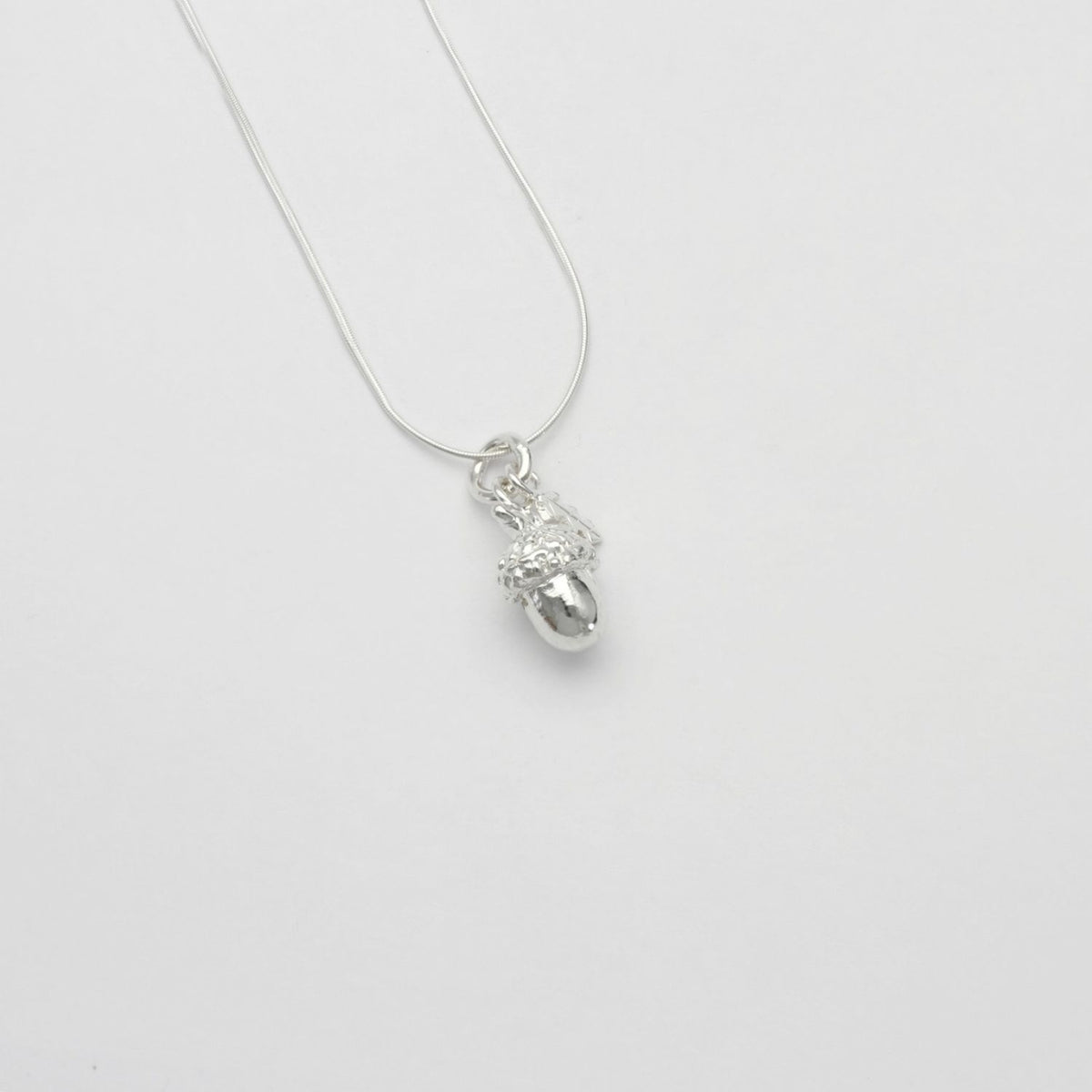 Acorn & leaf silver pendant by Emily Craig