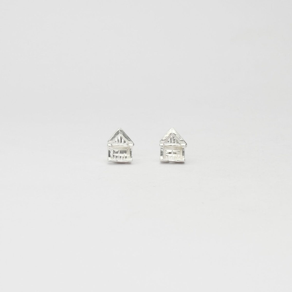 Beach hut silver stud earrings by Emily Craig