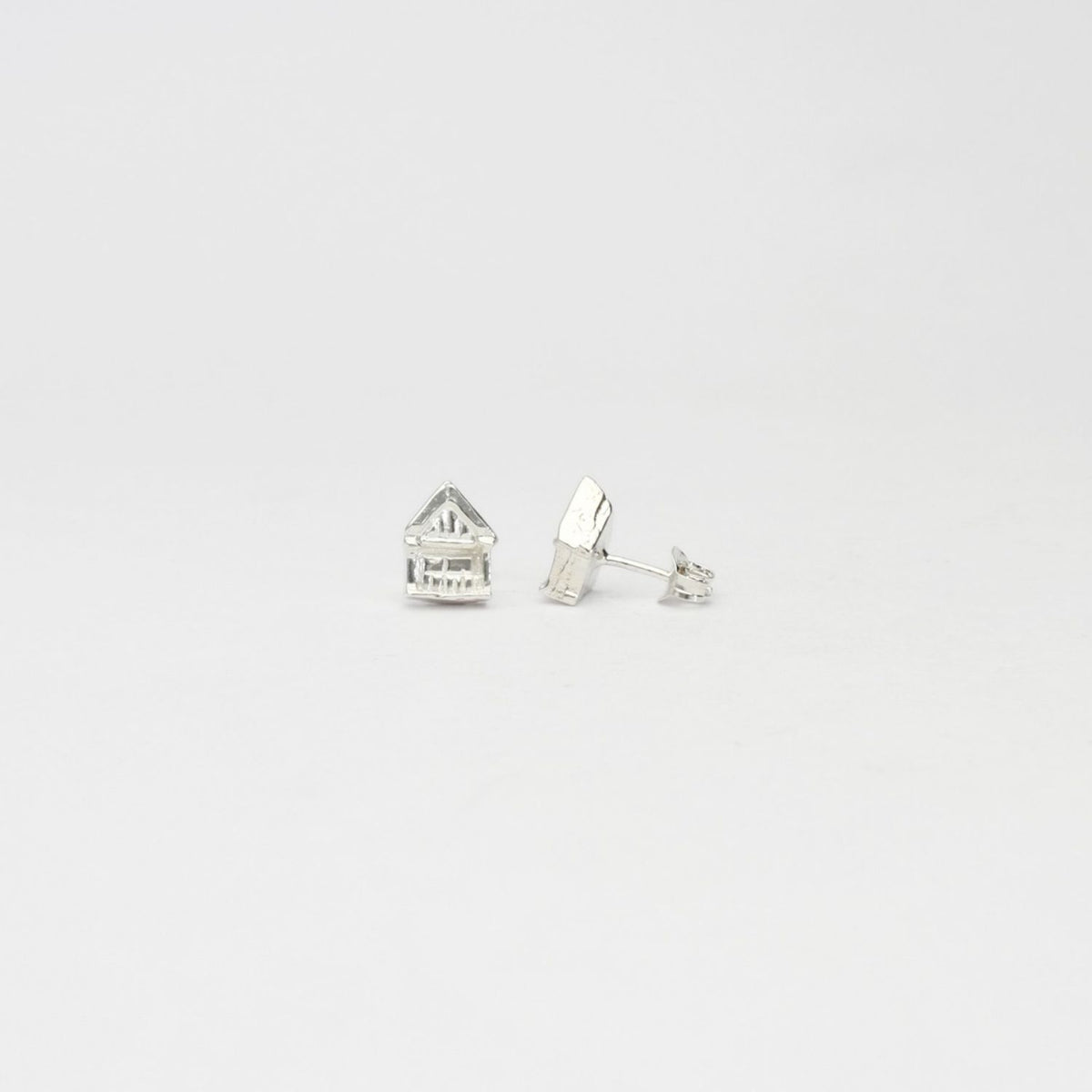 Beach hut silver stud earrings by Emily Craig