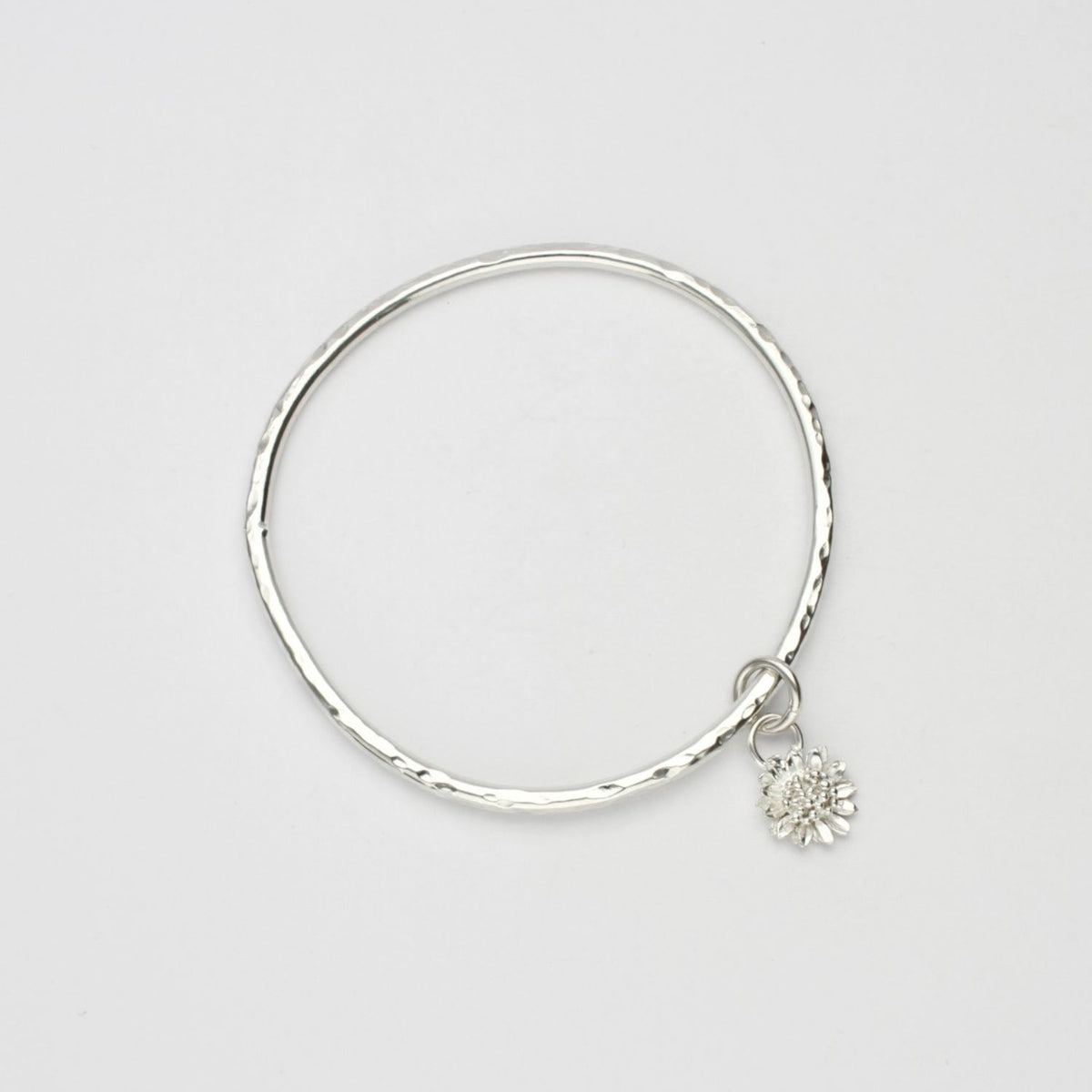 Sunflower silver charm bangle by Emily Craig