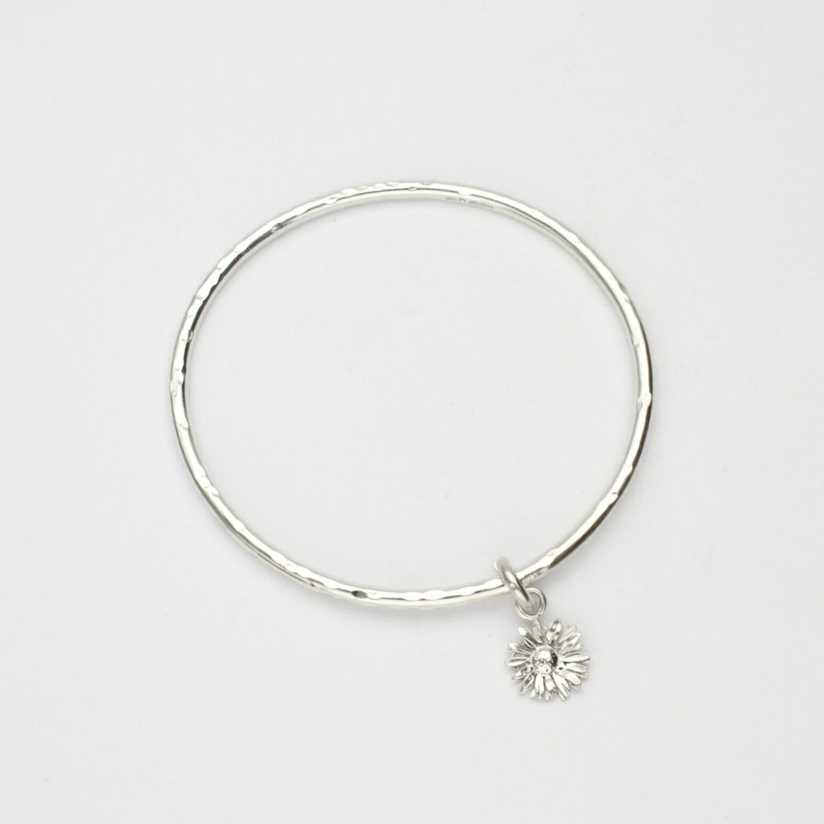 Daisy silver charm bangle by Emily Craig