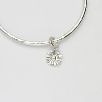 Daisy silver charm bangle by Emily Craig